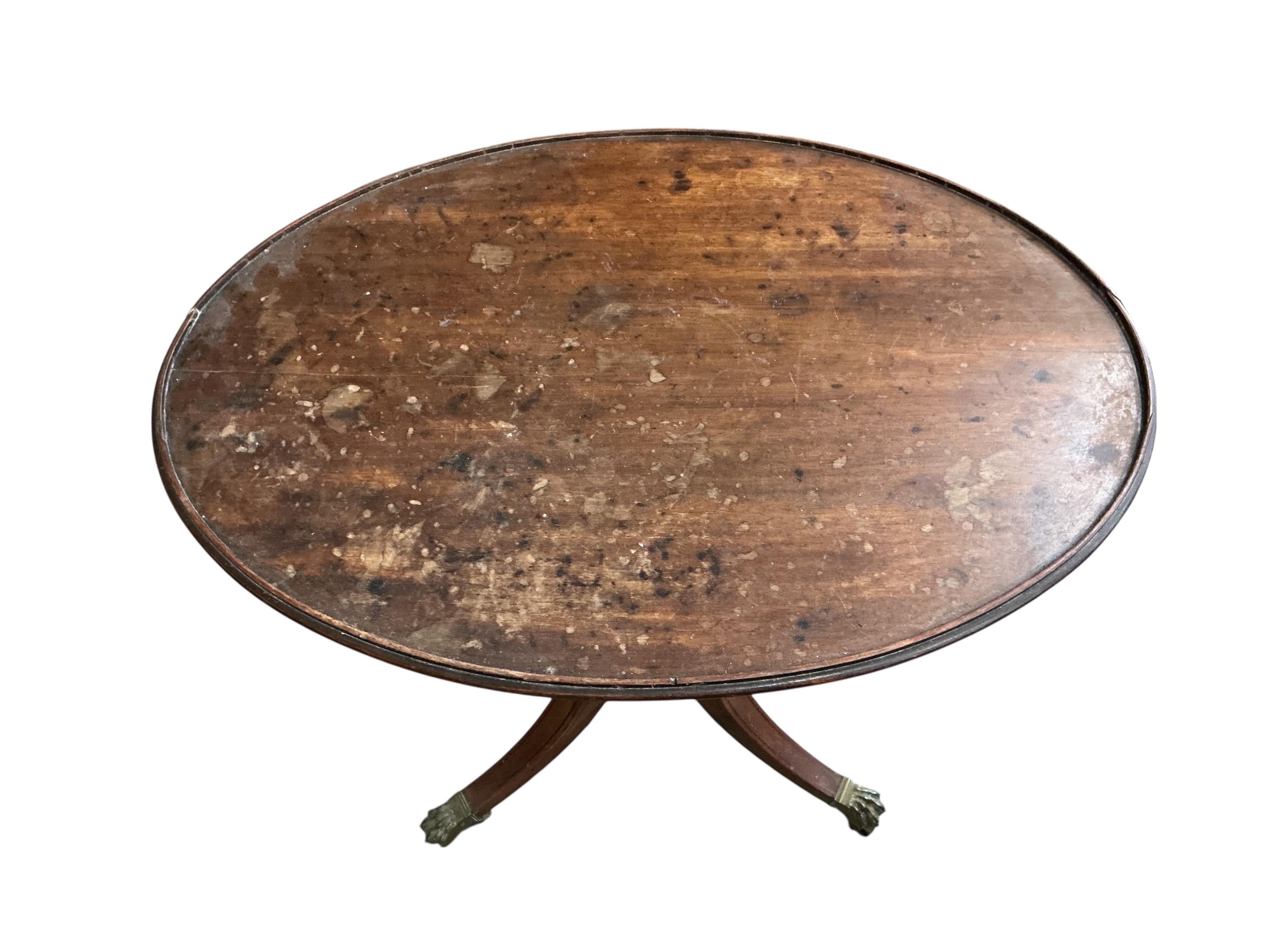 A Regency oval mahogany tripod wine table, width 70cm, depth 49cm, height 72cm